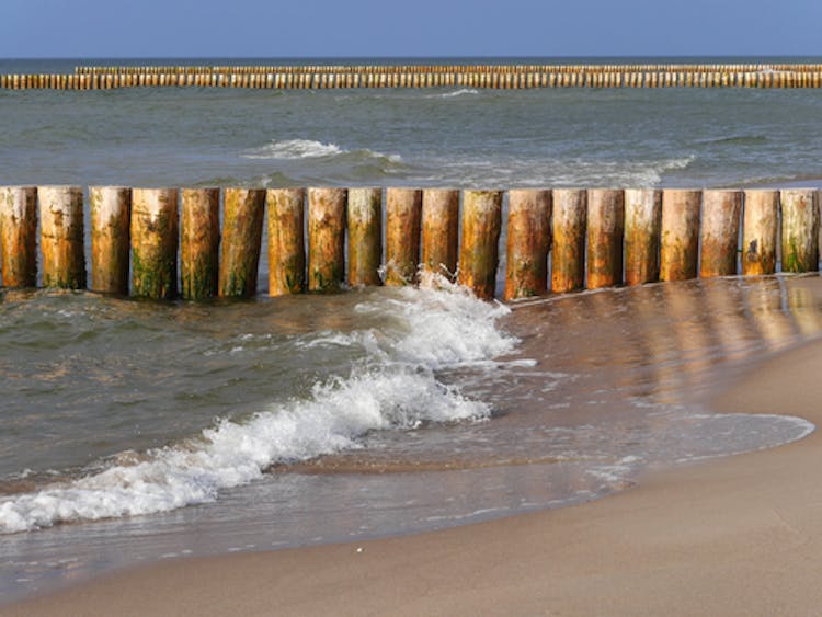 Groynes are used to break up waves hitting the coast line.